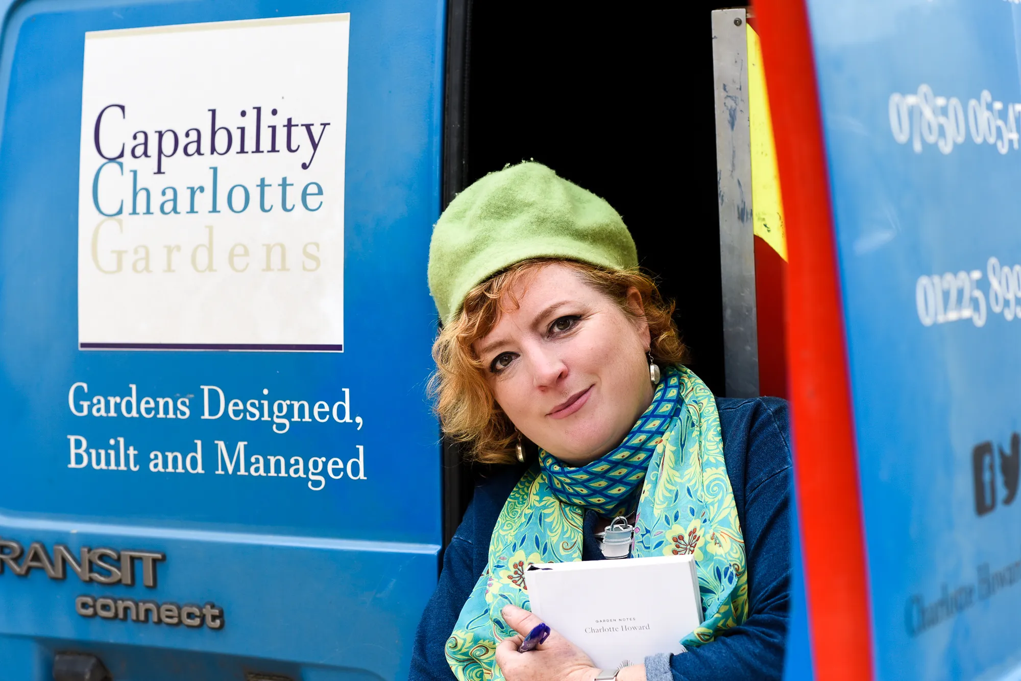 Charlotte sitting on the back of her van. Photo by Victoria Tapper